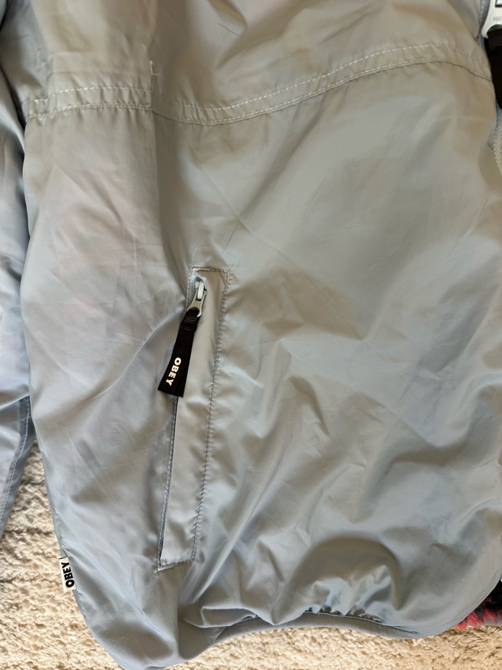 OBEY Light Blue Reversible Windbreaker Jacket with Branded Zip Pull - Picture 3 of 5